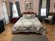 Comfortable bedroom with a patterned comforter, coordinated décor, and natural light at 11596 W Sierra Dawn Blvd # 209, Surprise, AZ 85378
