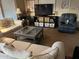 Cozy living room with neutral tones, comfortable seating, and a large television at 11596 W Sierra Dawn Blvd # 209, Surprise, AZ 85378