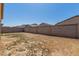 Large, sunny backyard with a block fence for privacy and a blank canvas for landscaping at 12143 W Marguerite Ave, Avondale, AZ 85323