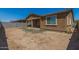 Expansive backyard featuring a patio and a view of the home's exterior at 12143 W Marguerite Ave, Avondale, AZ 85323