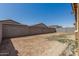 Open backyard area, enclosed by a block wall, offers potential for various landscaping designs at 12143 W Marguerite Ave, Avondale, AZ 85323