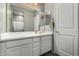 Bathroom with double sinks, white cabinets, and plenty of counter space at 12143 W Marguerite Ave, Avondale, AZ 85323