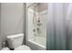 Clean bathroom with a toilet and a shower-tub combination with a shower curtain at 12143 W Marguerite Ave, Avondale, AZ 85323