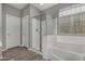 Well-lit bathroom showcasing a shower with glass enclosure and separate soaking tub at 12143 W Marguerite Ave, Avondale, AZ 85323