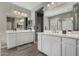 Spacious primary bathroom with dual sink vanity and wood-look tile at 12143 W Marguerite Ave, Avondale, AZ 85323