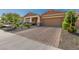 Attractive property with a brick driveway, two-car garage, and a tidy, low-maintenance front yard at 12143 W Marguerite Ave, Avondale, AZ 85323
