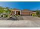 Charming single-story home with a two-car garage and nicely landscaped front yard at 12143 W Marguerite Ave, Avondale, AZ 85323