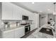 Well-appointed kitchen featuring sleek appliances, granite countertops, and custom cabinetry at 12143 W Marguerite Ave, Avondale, AZ 85323
