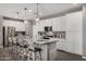 Kitchen featuring a large center island with seating and pendant lighting at 12143 W Marguerite Ave, Avondale, AZ 85323
