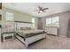Bright main bedroom showcasing ceiling fan, neutral walls, and lots of light at 12143 W Marguerite Ave, Avondale, AZ 85323
