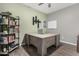 Spacious home office features a desk, shelving, and neutral color palette at 12143 W Marguerite Ave, Avondale, AZ 85323