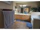 Bathroom with double sink vanity, bathtub, and modern fixtures at 12237 W Sherman St, Avondale, AZ 85323