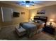 Cozy bedroom featuring soft carpeting, a ceiling fan, and neutral paint tones at 12237 W Sherman St, Avondale, AZ 85323