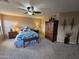 Spacious bedroom with ceiling fan, plush carpeting, and ample natural light at 12237 W Sherman St, Avondale, AZ 85323