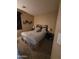 Cozy bedroom with neutral tones, carpet flooring, decorative wall art, and comfortable furnishings at 12237 W Sherman St, Avondale, AZ 85323