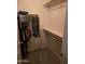 Organized closet with shelving and ample hanging space for clothing storage at 12237 W Sherman St, Avondale, AZ 85323