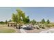 Community park featuring a covered picnic area, playground and lush landscaping at 12237 W Sherman St, Avondale, AZ 85323