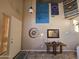 Well-lit foyer area with wall decor and tiled floors for a stylish entrance at 12237 W Sherman St, Avondale, AZ 85323