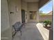 Cozy covered porch featuring a bench and security door for a relaxing outdoor welcome at 12237 W Sherman St, Avondale, AZ 85323