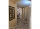 Inviting hallway featuring neutral tones, decorative accents, and seamless flow to the home's other spaces at 12237 W Sherman St, Avondale, AZ 85323