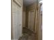 Hallway with neutral wall colors and multiple doors that provide entry to other spaces in the house at 12237 W Sherman St, Avondale, AZ 85323
