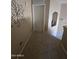 Upstairs hallway featuring carpeted flooring, neutral paint, and doors leading to other rooms at 12237 W Sherman St, Avondale, AZ 85323