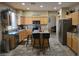 Spacious kitchen features stainless steel appliances, a center island with bar seating and lots of countertop space at 12237 W Sherman St, Avondale, AZ 85323