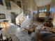 Open-concept space with tile flooring, staircase, living room furniture, and dining area at 12237 W Sherman St, Avondale, AZ 85323