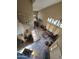 High-angle view of the open-concept living space, stairs, dining area, and two-story ceilings at 12237 W Sherman St, Avondale, AZ 85323