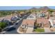 An aerial view of the home in a suburban neighborhood with mountain views in the background at 1226 E Presidio Rd, Phoenix, AZ 85022