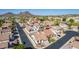 This aerial shot shows a house with a tile roof, surrounded by a well-kept residential area at 1226 E Presidio Rd, Phoenix, AZ 85022