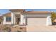 Home featuring a tile roof, a two-car garage, and desert landscaping, as well as decorative front door at 1226 E Presidio Rd, Phoenix, AZ 85022