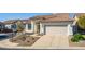 Charming home with a two-car garage, well-manicured landscaping, and a welcoming entrance at 1226 E Presidio Rd, Phoenix, AZ 85022