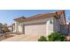 Two car garage with low maintenance desert landscaping at 1226 E Presidio Rd, Phoenix, AZ 85022