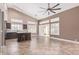 Open-concept kitchen featuring a center island, breakfast bar, modern cabinetry, and lots of natural light from multiple windows at 1226 E Presidio Rd, Phoenix, AZ 85022