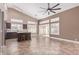 Bright kitchen features an island with seating, modern cabinetry, and lots of natural light from multiple windows and sliding doors at 1226 E Presidio Rd, Phoenix, AZ 85022