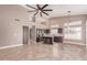 Spacious kitchen with stainless steel appliances, a center island with barstool seating, and ample cabinet space at 1226 E Presidio Rd, Phoenix, AZ 85022