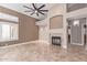 Spacious living room featuring tile floors, a fireplace, recessed lighting, and plantation shutters at 1226 E Presidio Rd, Phoenix, AZ 85022