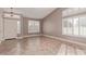 Open living area with tile flooring, plantation shutters and a view of the front door at 1226 E Presidio Rd, Phoenix, AZ 85022