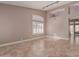 Bright living room featuring tile floors, plantation shutters and modern lighting at 1226 E Presidio Rd, Phoenix, AZ 85022