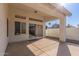 Inviting covered patio with sliding glass doors offering seamless indoor-outdoor flow and backyard views at 1226 E Presidio Rd, Phoenix, AZ 85022