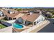 A backyard oasis with a sparkling pool and a covered patio, surrounded by privacy fencing at 1226 E Presidio Rd, Phoenix, AZ 85022