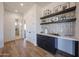 Open bar and hallway area, white countertops, and hardwood floors at 1250 E Smokehouse Trl, Phoenix, AZ 85085