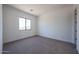 Neutral bedroom featuring carpet and a window offering natural light at 1250 E Smokehouse Trl, Phoenix, AZ 85085