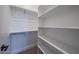 Organized walk-in closet with shelving and rod providing ample storage space at 1250 E Smokehouse Trl, Phoenix, AZ 85085
