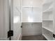 Well-organized walk-in closet with ample shelving and rods, offering plenty of storage space at 1250 E Smokehouse Trl, Phoenix, AZ 85085