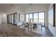 Modern dining area featuring a stylish table and chairs with art and bright natural light at 1250 E Smokehouse Trl, Phoenix, AZ 85085