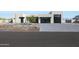 Beautiful modern home with desert landscaping and a stylish two-car garage with glass doors at 1250 E Smokehouse Trl, Phoenix, AZ 85085