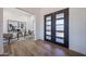 Welcoming foyer with stylish doors and wood-look tile floors at 1250 E Smokehouse Trl, Phoenix, AZ 85085