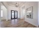 Bright foyer with a stylish entry door and wood-look tile floors at 1250 E Smokehouse Trl, Phoenix, AZ 85085